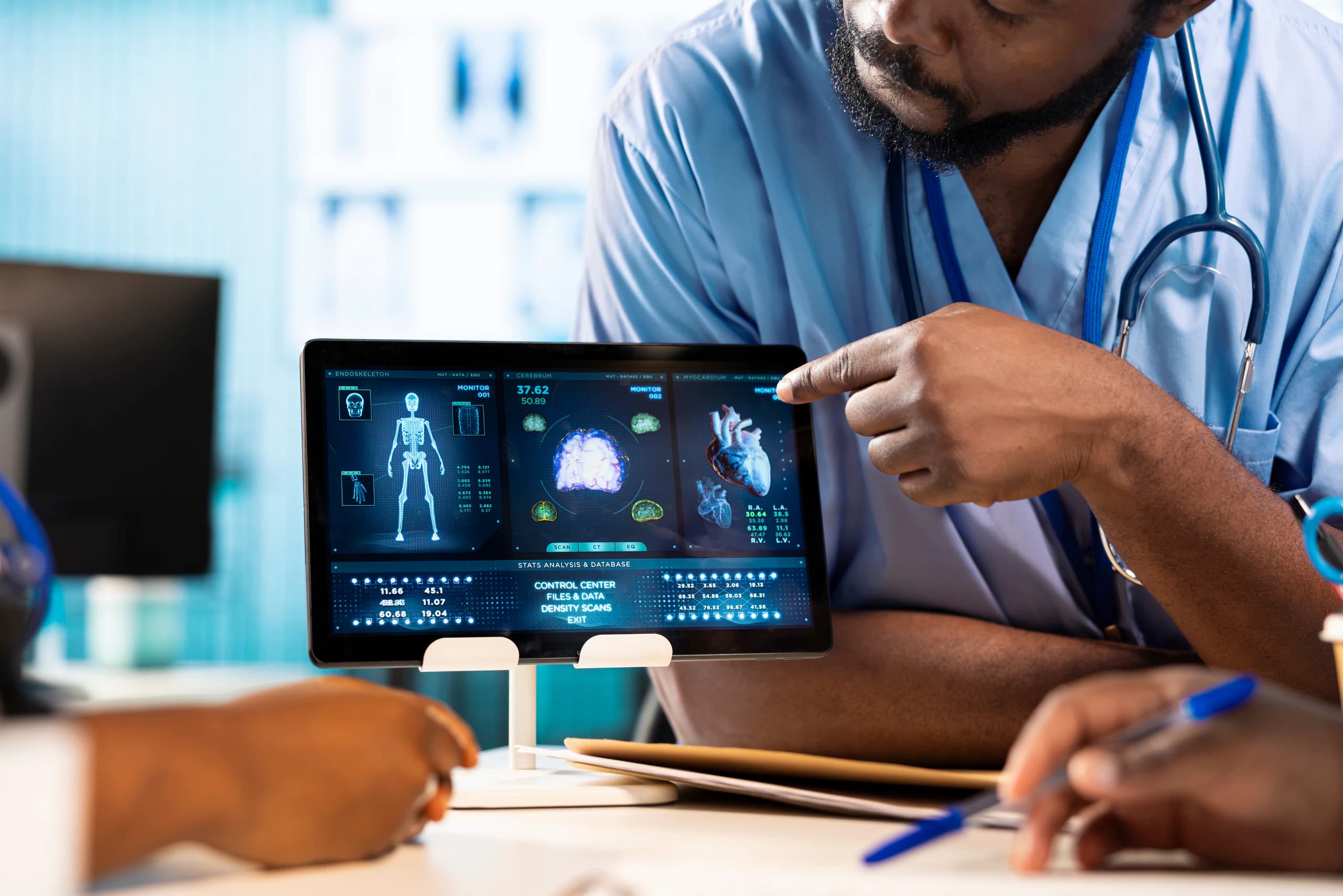 Healthcare professionals reviewing digital medical dashboards